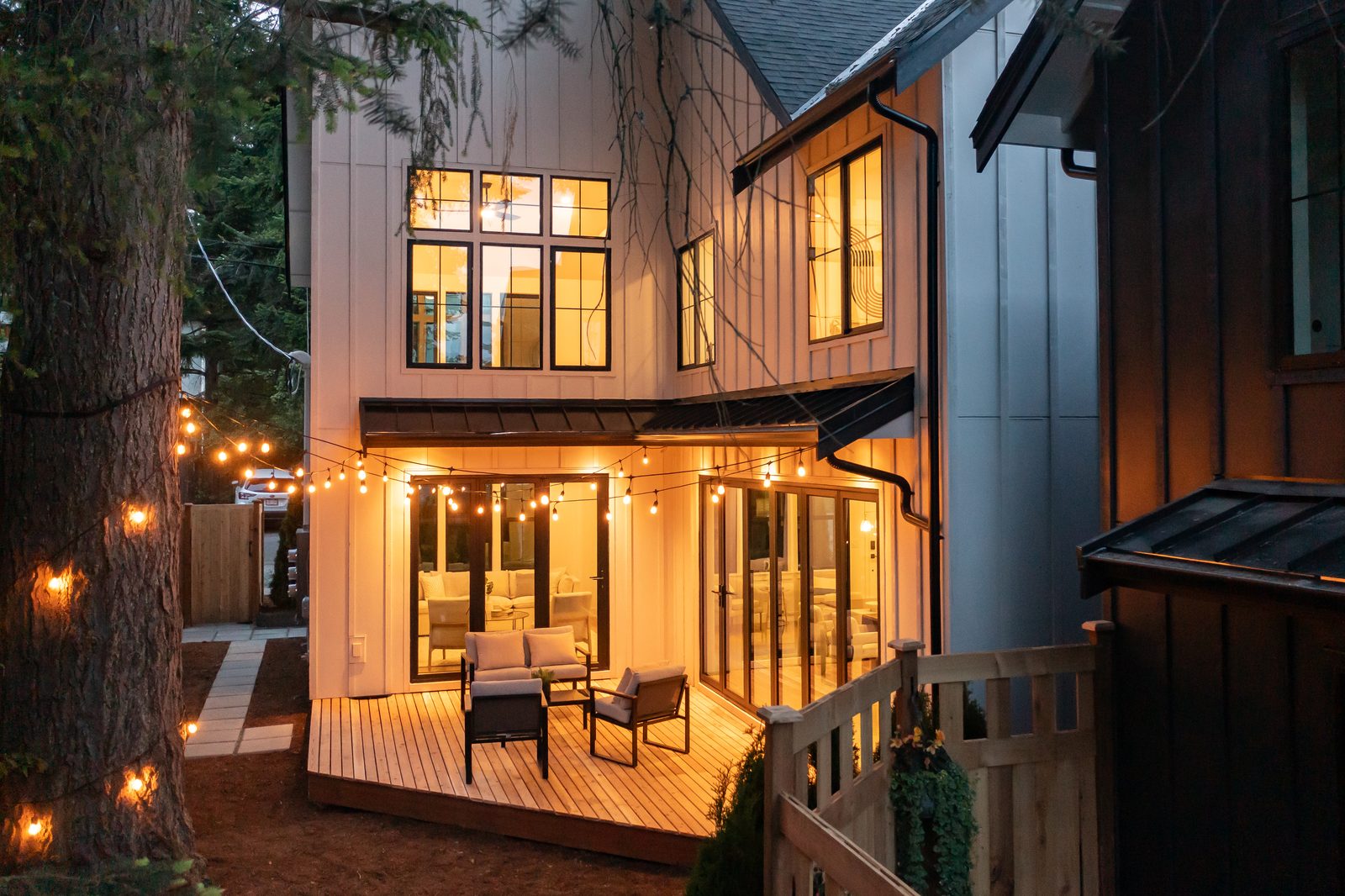 Aerial view of a forest cabin short-term rental managed by Stay Flourish, surrounded by evergreen trees